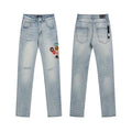 AMIRI Light Blue Patch Detail Slim Tapered Jeans — hero