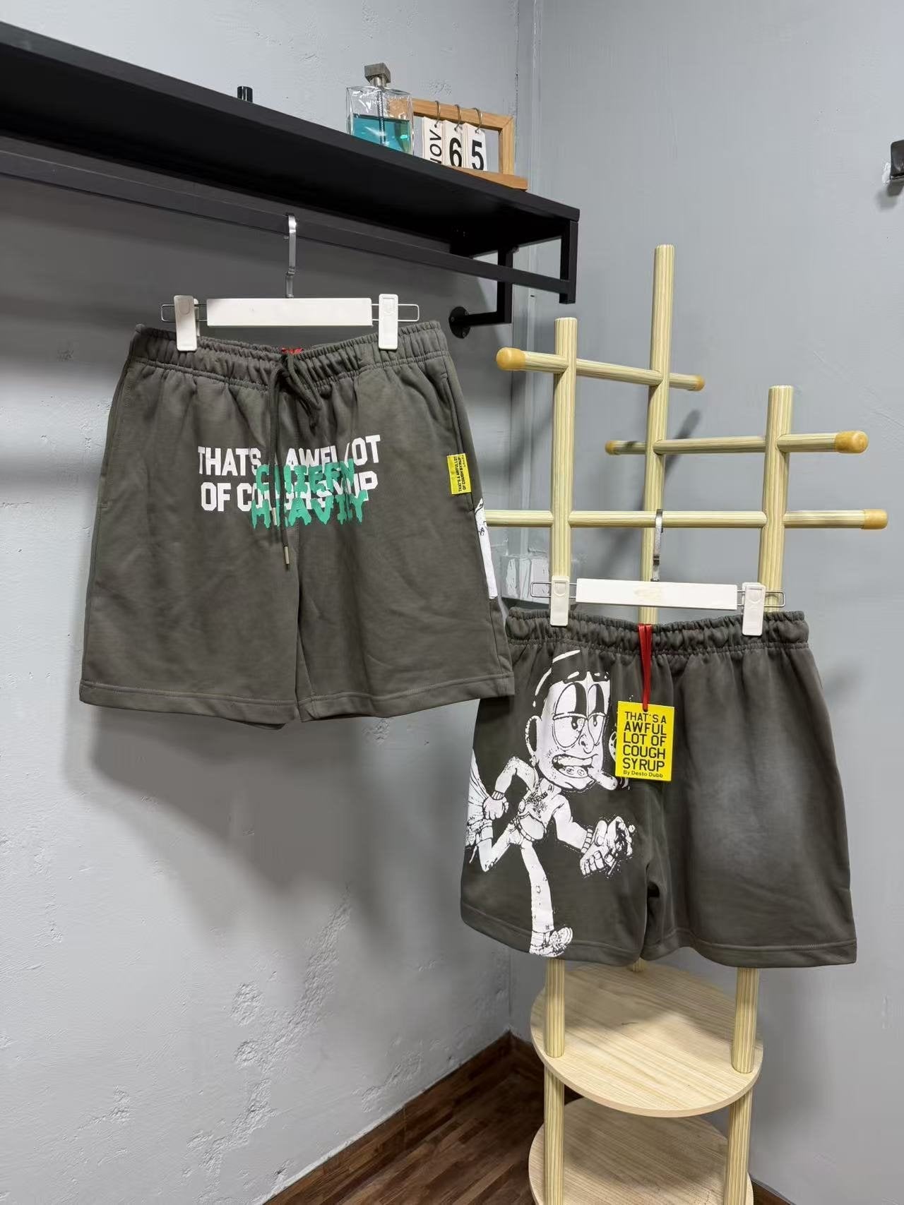 THAT'S A AWFUL LOT OF COUGH SYRUP Cartoon Back Graphic Shorts — front